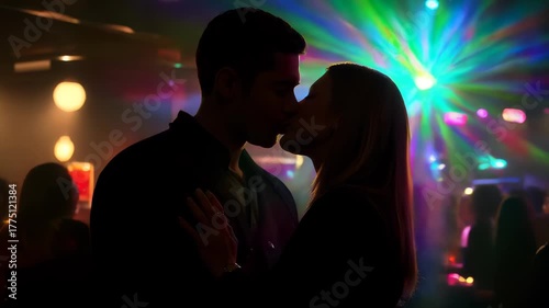 Romantic Couple Kissing in Nightclub with Colorful Lights
