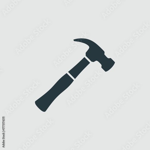 Simple dark silhouette of a claw hammer on a light background