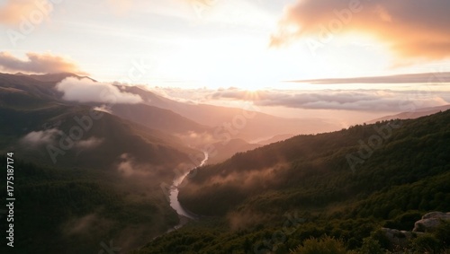 Golden sunrise paints misty valley mountains, serene escape awaits.