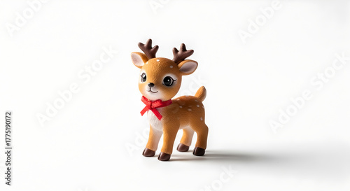 Cute Small Cartoon Reindeer Figurine with Red Bow on White Background