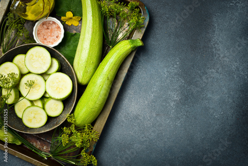 A bowl of sliced zucchini ready for cooking. Close-up. Top view. © Yaruniv-Studio