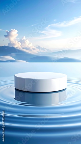 A white platform reflects in rippling water with a mountainous landscape against a blue sky