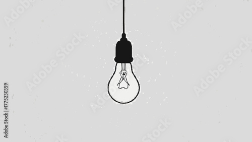 Glowing light bulb hanging in the dark signifying a bright idea of innovation and creativity
