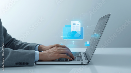 A person interacts with a laptop featuring a futuristic digital interface, displaying floating file folders and documents, highlighting concepts of data management, file sharing, and cloud storage.