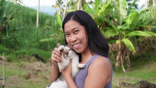 young woman waving the cat's paw 