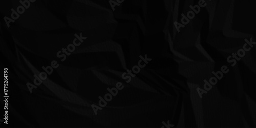 Black crumpled paper creased grunge texture. Paper wrinkled surface glued paper poster background.