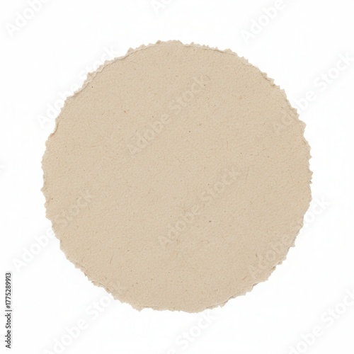 A ripped beige paper circle with a textured edge on a white background