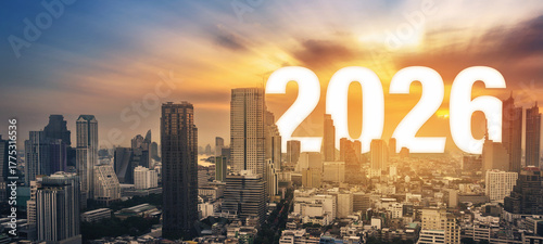 Photos Modern city skyline at sunset with large number 2026, representing new year