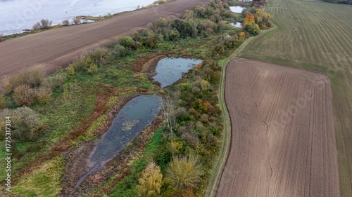 Aerial Vistula River farm land northern Poland 2. Forests with rural farm agriculture farm landscape. Historic and economic basis of eastern Europe. Autumn fall colors. Rich agricultural heritage.
