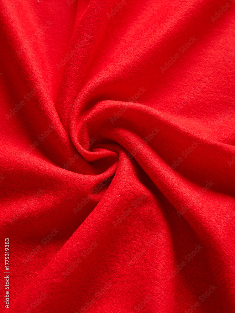 Obraz premium Bright Red Fabric Showing a Swirling Textured Pattern Up Close