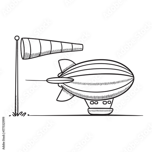 A zeppelin close to a windsock fluttering in the breeze