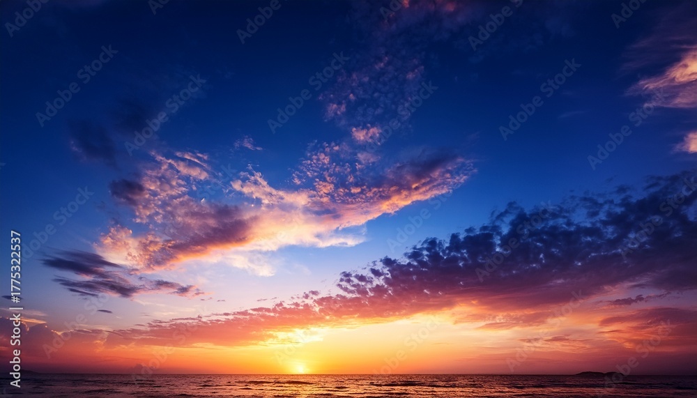 Obraz premium Vibrant Sunset With Twilight Sky And Clouds