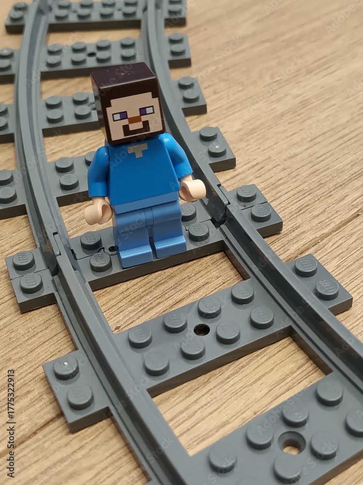 Naklejka premium LEGO Minecraft Steve Minifigure on Curved Railroad Track