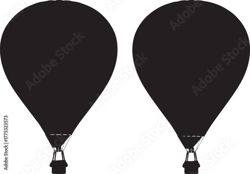 Two hot air balloons in silhouette