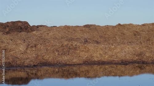 Natural manure is shown being prepared to enrich the soil in open fields for improved crop growth and fertility