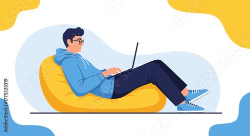 Relaxed Man Working on Laptop, Lounging in Casual Wear, Modern Digital Lifestyle