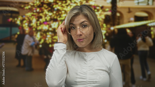 Wallpaper Mural Young blonde woman pointing finger to temple in building; insight inspiration thoughtful contemplation. Torontodigital.ca