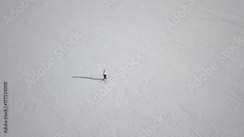 Recreative cross-country skier at snow-covered frozen lake