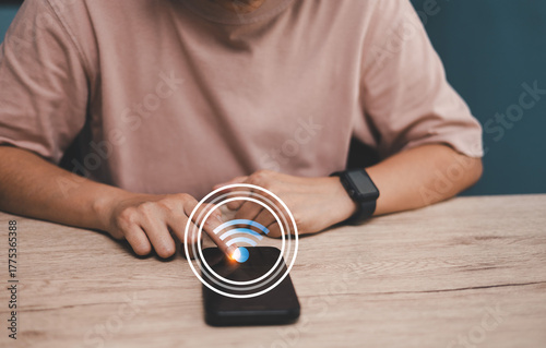 Person using smartphone connect to Wi-Fi representing wireless internet connection, surfing internet online social media communication technology, and digital lifestyle modern smart life concepts