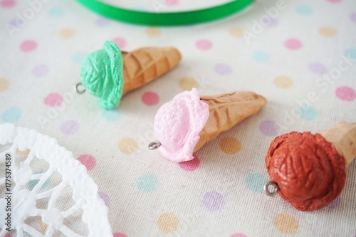 Colorful Miniature Ice Cream Cone Charms for DIY Jewelry and Crafts. Sweet Miniature Ice Cream Cones Flat Lay. Miniature Ice Cream Cone Charms Collection. 