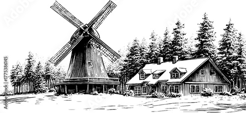 Snow-covered windmill with wooden blades in winter rural scene