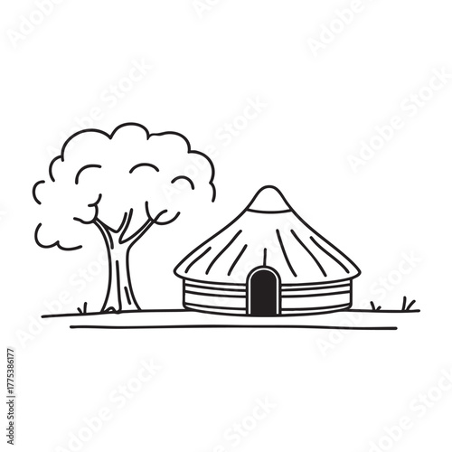 A yurt near a tree casting long afternoon shadows