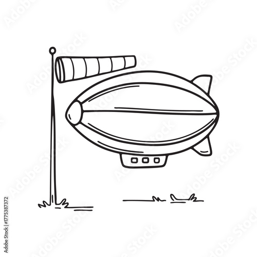 A zeppelin beside a windsock waving in the breeze