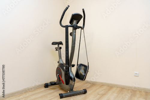 Modern exercise bike in a bright and simple home gym setting