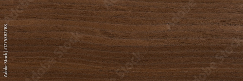 Natural oak veneer background in expensive dark brown color. Natural wood texture, pattern of a long veneer.