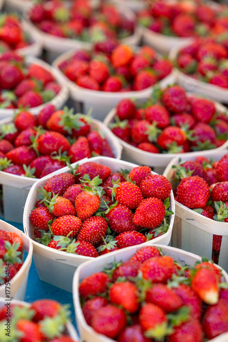 Fresh strawberries selling in baskets at market