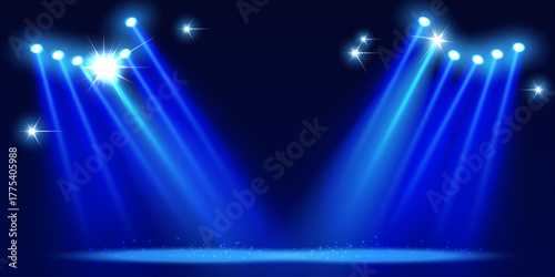 Bright blue concert spotlights create the effect of shining stars on the stage.