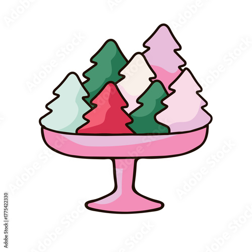 pink pedestal bowl filled with Christmas tree-shaped  sweets