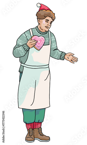 Smiling Christmas market vendor man in apron holding a heart-shaped gingerbread 