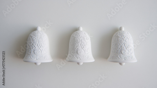 White patterned Christmas bells with white background wall
