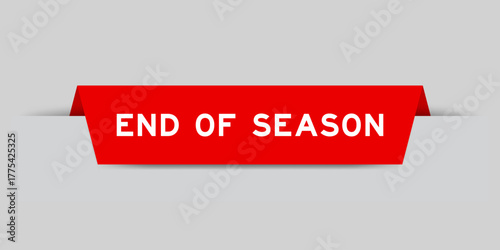 Red color inserted label with word end of season on gray background