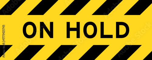 Yellow and black color with line striped label banner with word on hold