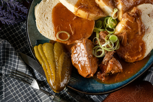 Czech dumplings with stewed pork in sauce.