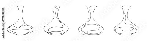 Four elegant glass wine decanters with unique designs ready for wine
