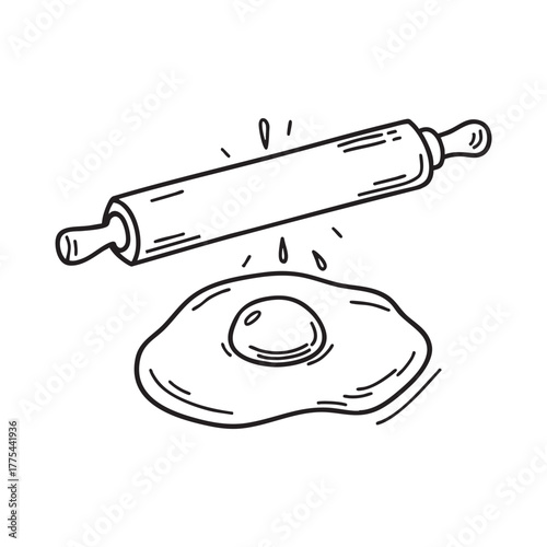 A yolk lying beside a rolling pin dusted with flour