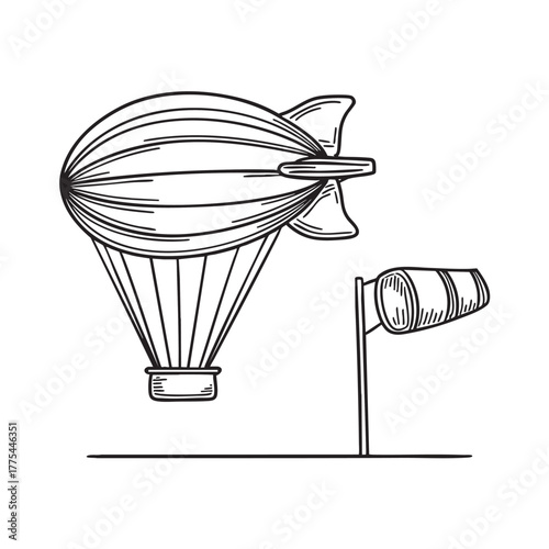 A zeppelin beside a windsock blowing in the wind