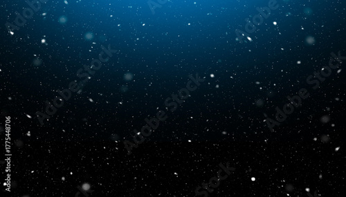 Falling Snow Particles on Dark Blue Background stock photo
