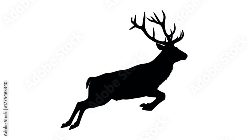 Silhouette of a stag leaping with large antlers deer