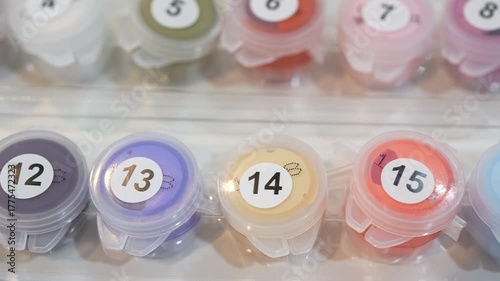 Closeup View of Set of Acrylic Color Boxes for Painting by Numbers. 
