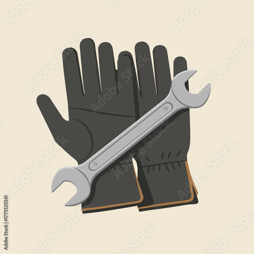 A pair of dark work gloves with a silver wrench on a light background.