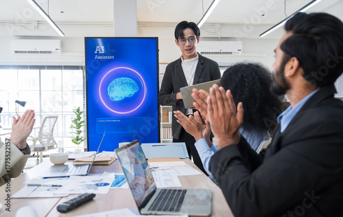 Multiethnic business and creative team collaborating meeting in modern office using AI assistant, big data, and digital tools for innovation and strategy.