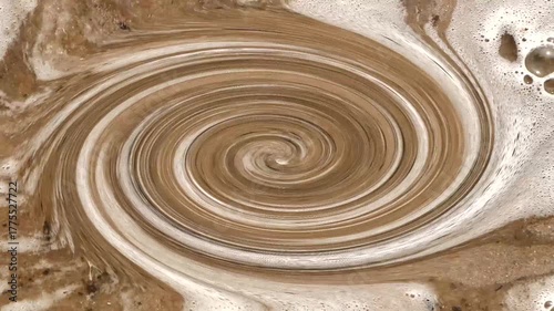 White foam from the sea waves in the whirlpool.