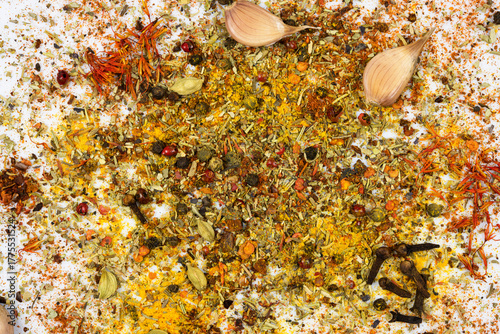 Fotografía Assortment of oriental spices scattered on a white background
