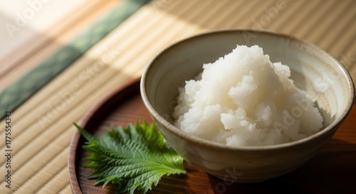 Delectable Mountain Of Grated Daikon In A Bowl On A Wooden Tray With Herb