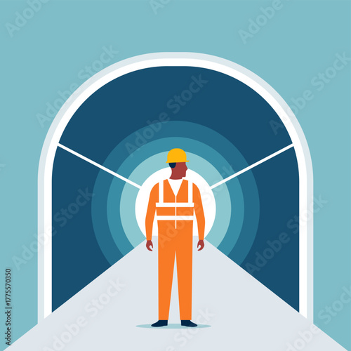 Professional civil engineer worker on road to tunnel entrance. Construction site inspection, infrastructure development and underground earthworks or safety maintenance for the transportation industry