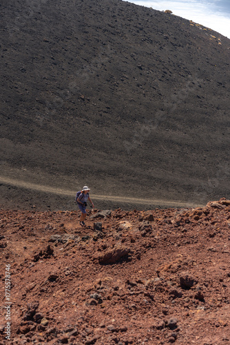Woman hiking on volcanic slope
